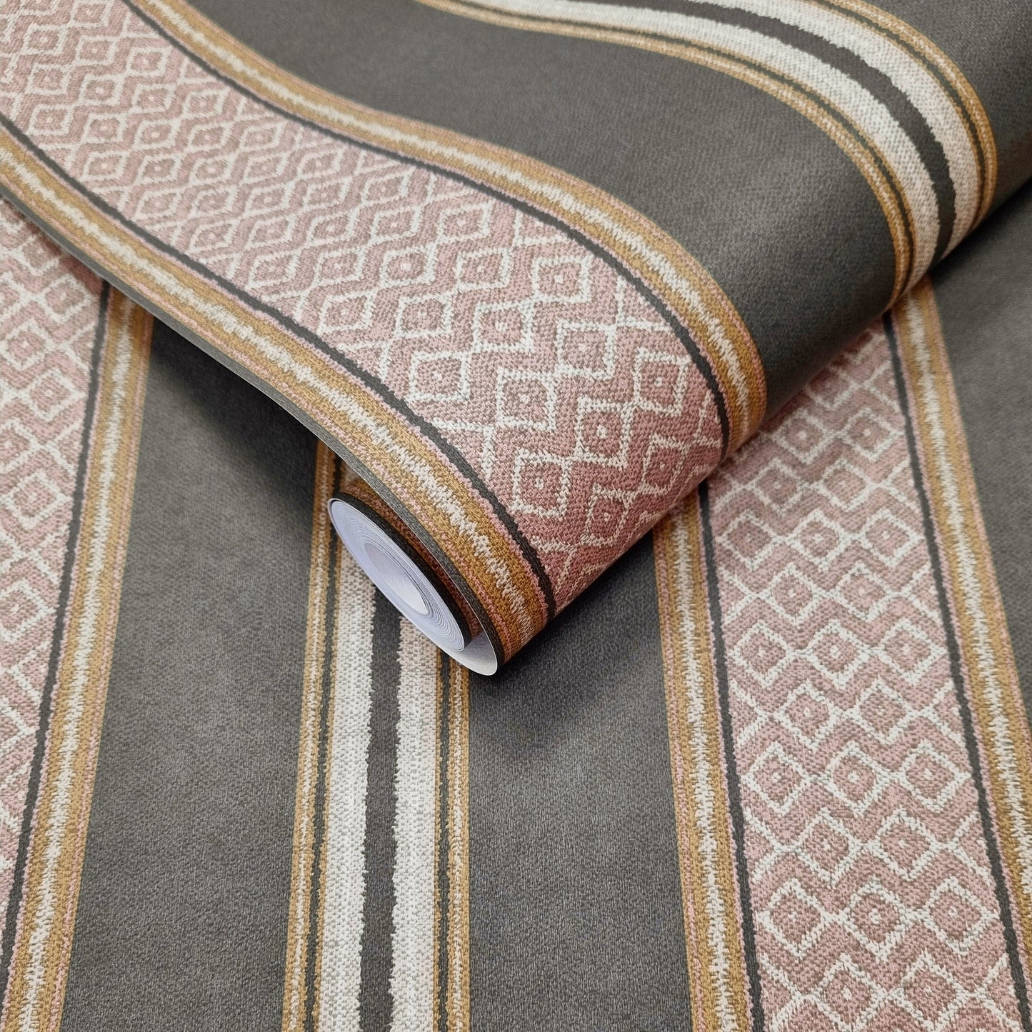Patola Charcoal wallpaper roll showing the woven-stripe repeat