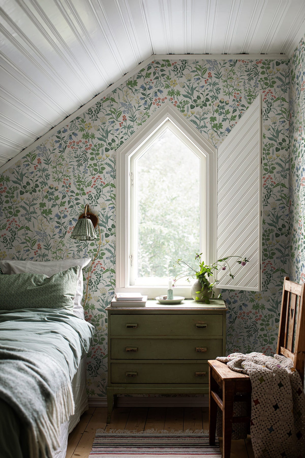 Flora wallpaper in White on a bedroom wall