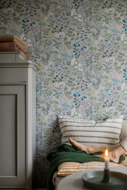 Flora wallpaper in Blue-Grey on a living room wall