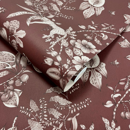 Liana Maroon wallpaper roll showing the tonal leopard and pomegranate repeat