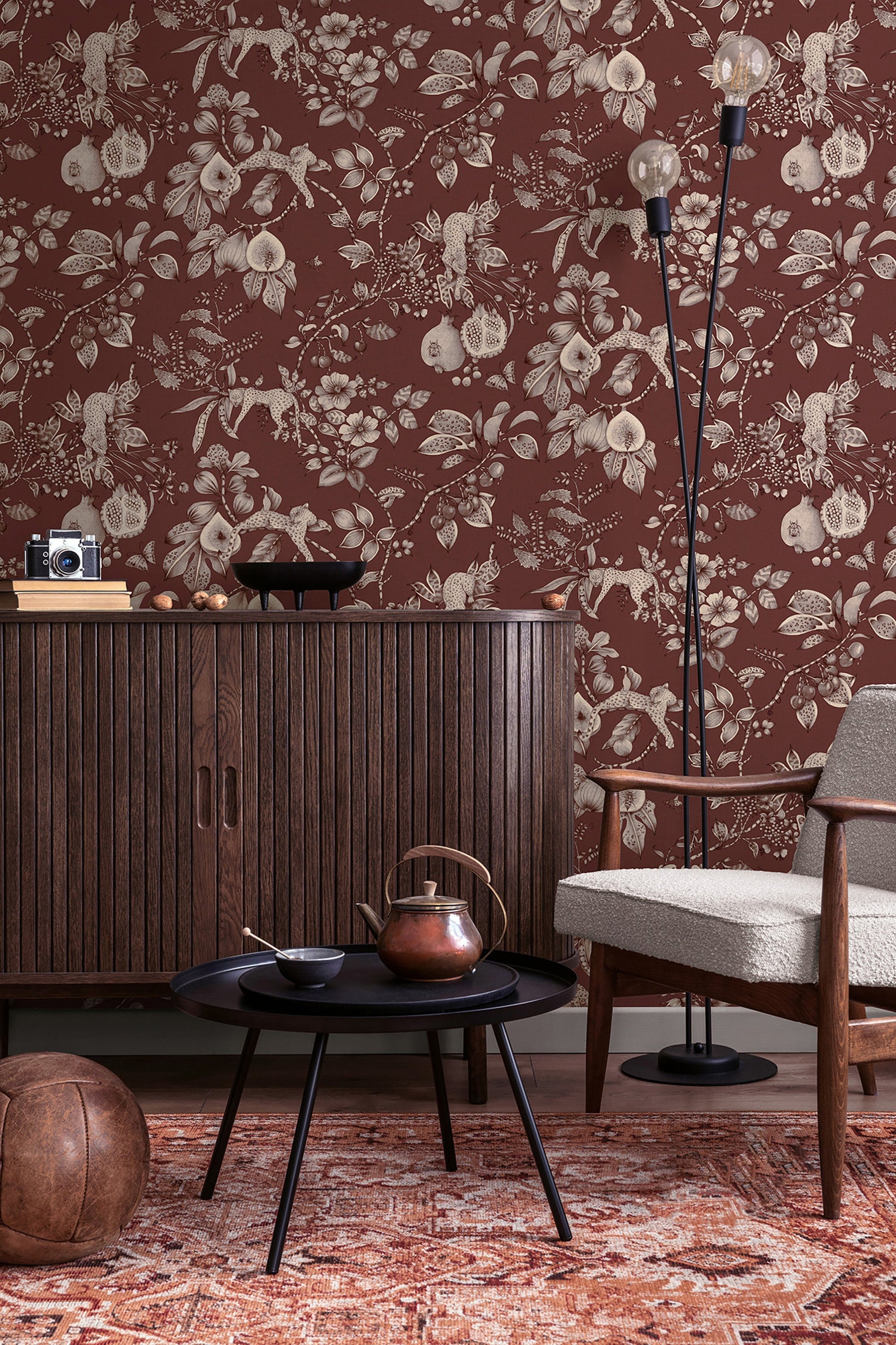 Liana wallpaper in Maroon on a feature wall, leopards and pomegranates in fine linework