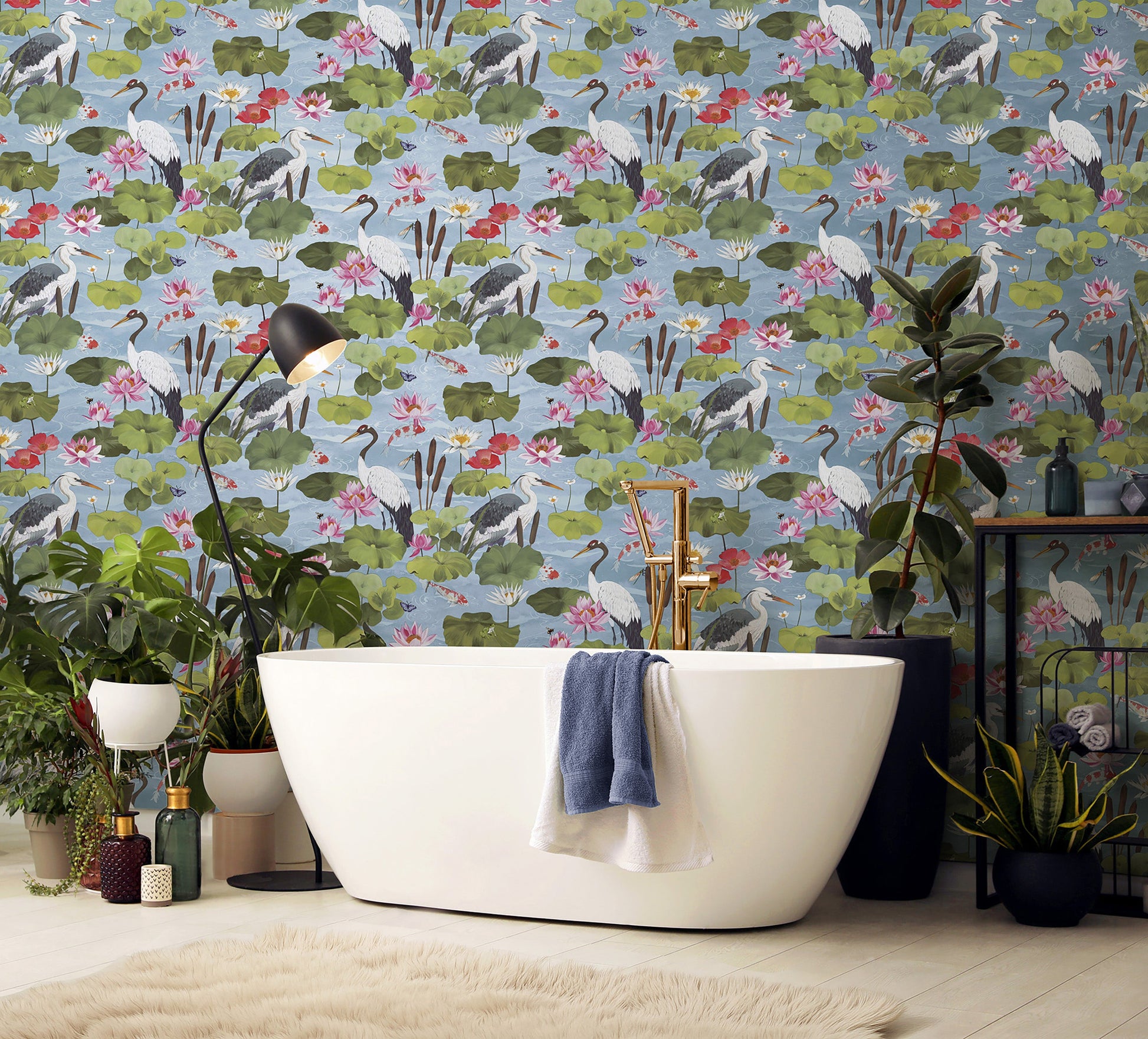 Hermine wallpaper in Sky Blue on a feature wall, koi pond scene with cranes and lily pads