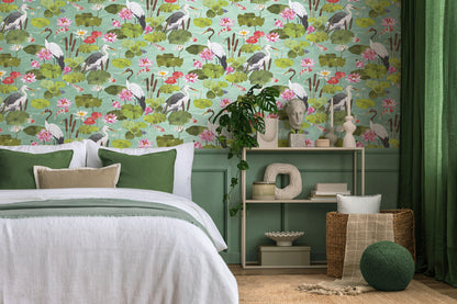 Hermine wallpaper in Light Teal on a feature wall, koi pond scene with cranes and lily pads