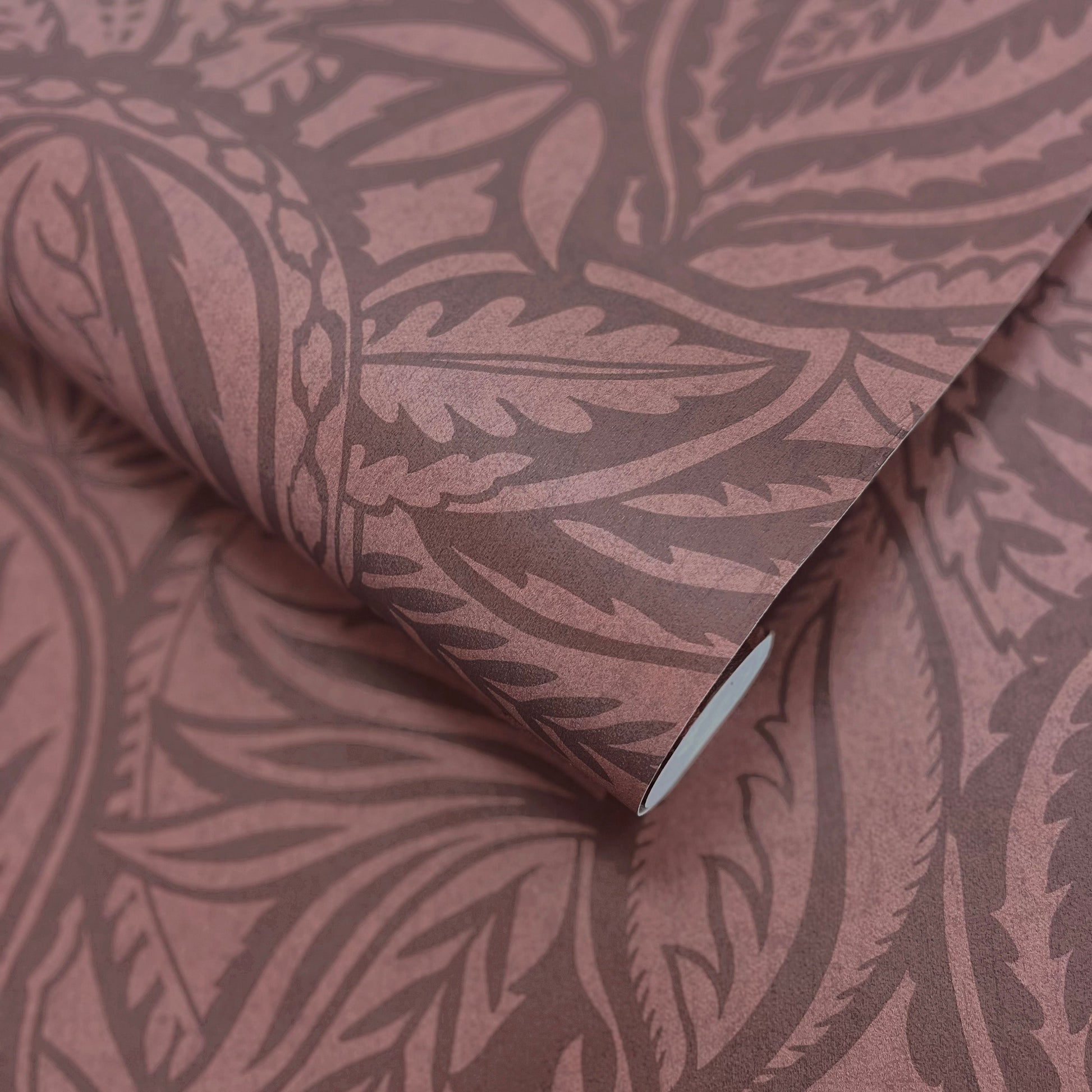 Musa Maroon wallpaper roll showing the abstract leaf repeat