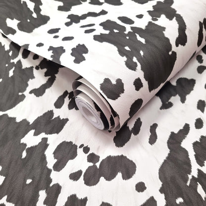 Holstein Black and White wallpaper roll showing the cowhide-pattern repeat