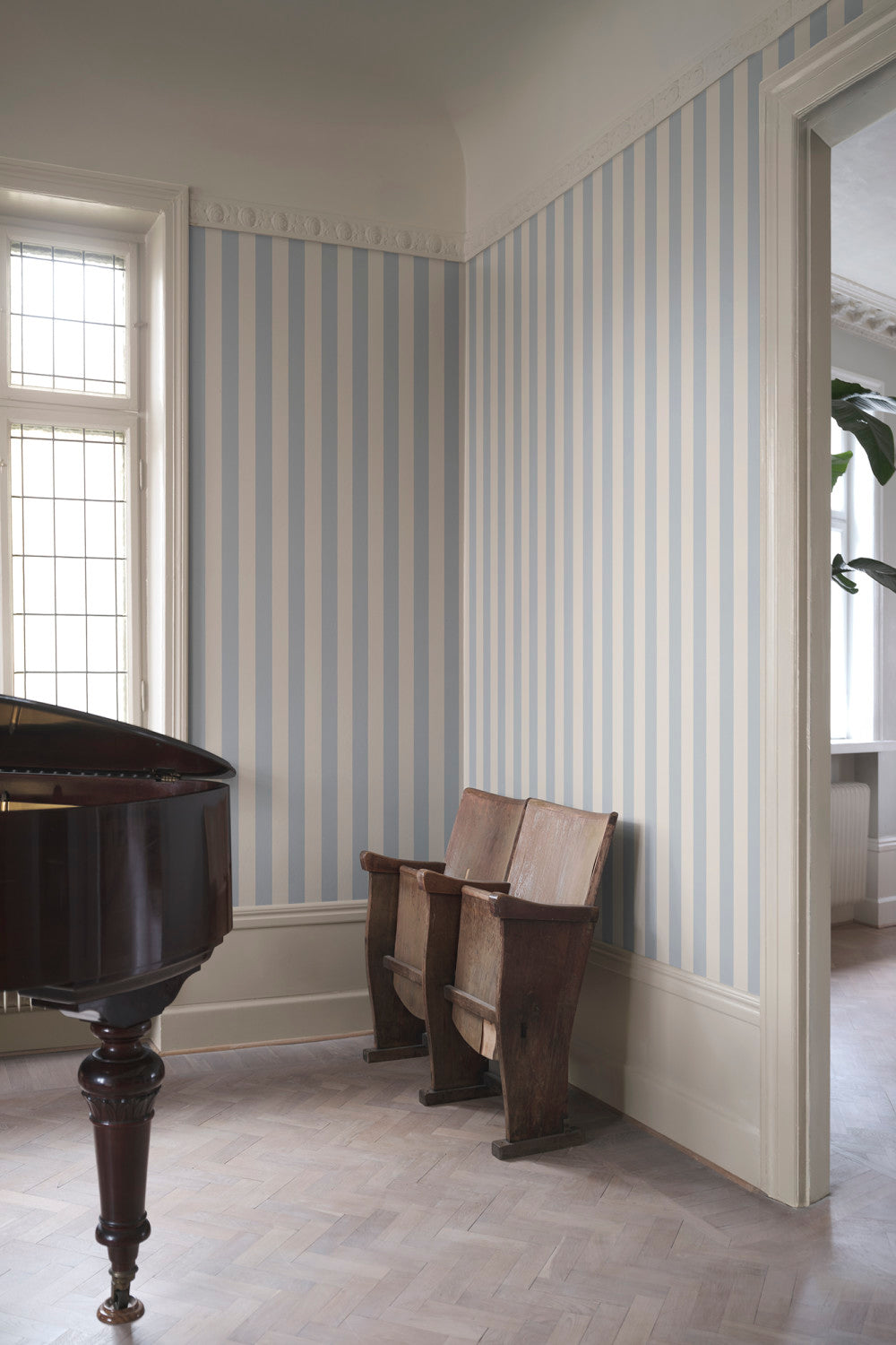 Sam Narrow Striped wallpaper in Light Blue in a room setting