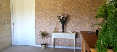 In love with the amazing transformation this wallpaper has given our entrance way / living area